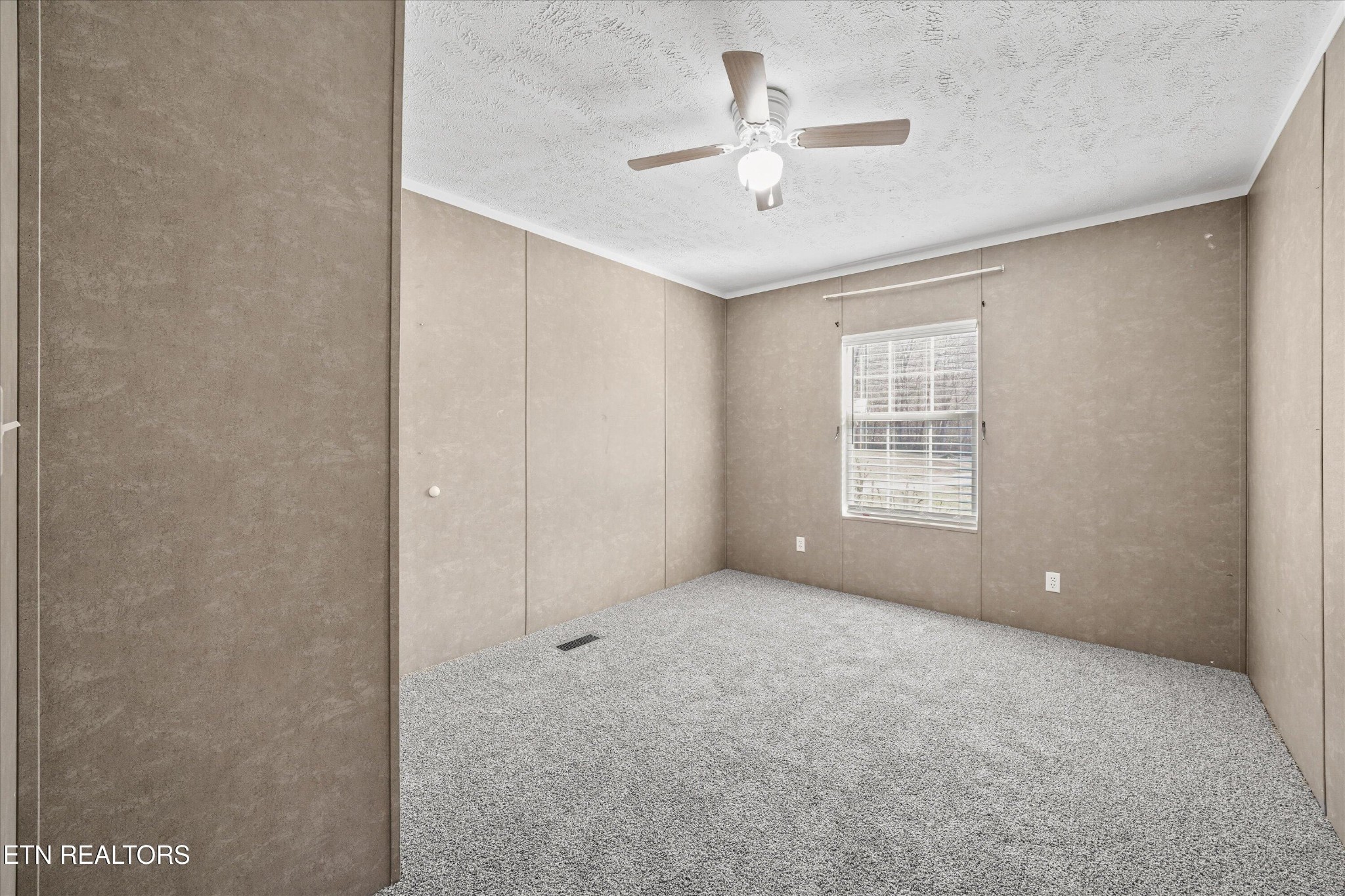 603 Bays Mountain Road Knoxville, TN 37920 - Photo 15 of 30 an empty room with windows and fan