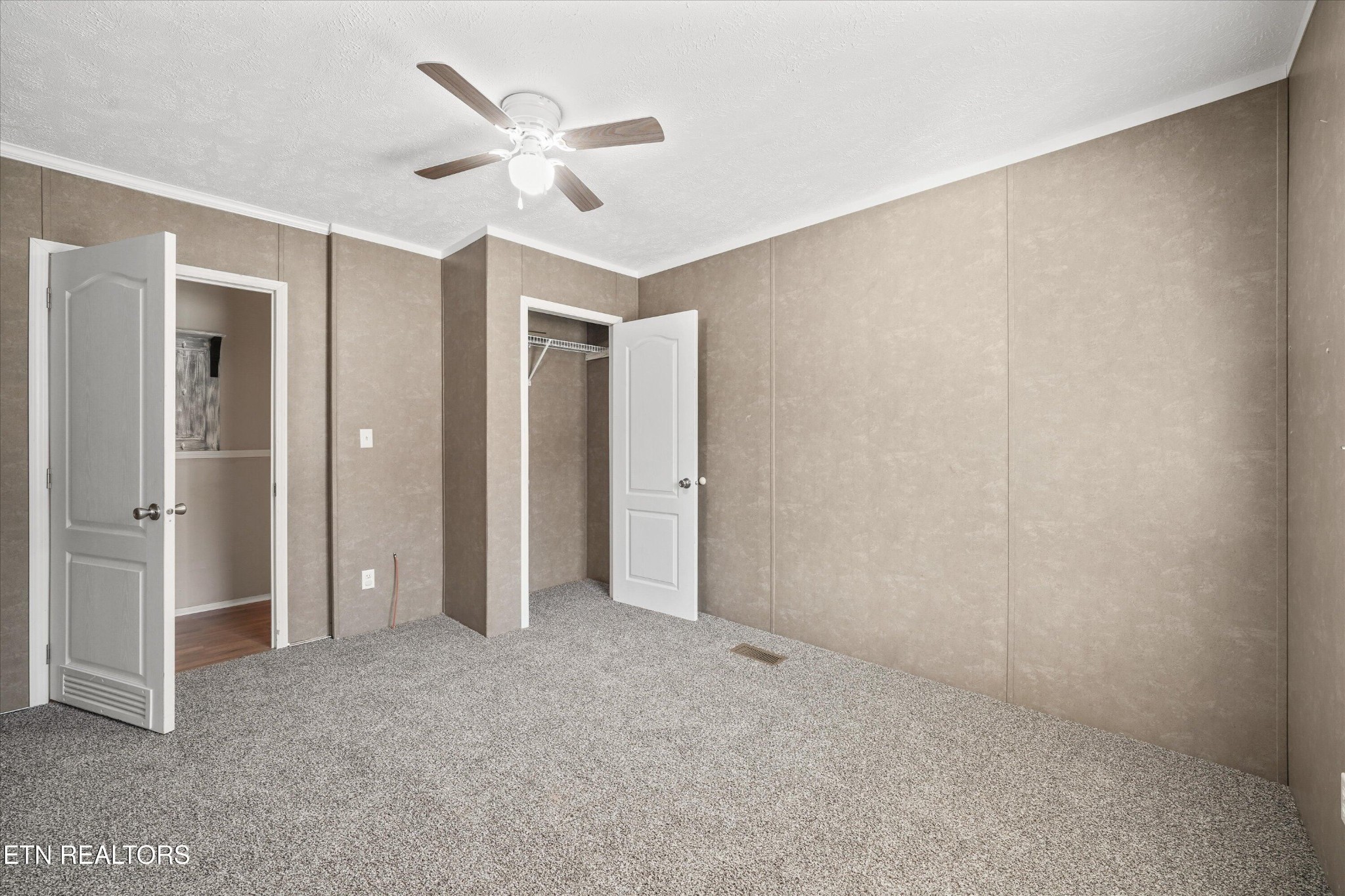 603 Bays Mountain Road Knoxville, TN 37920 - Photo 16 of 30 a view of a livingroom with a ceiling fan & entryway