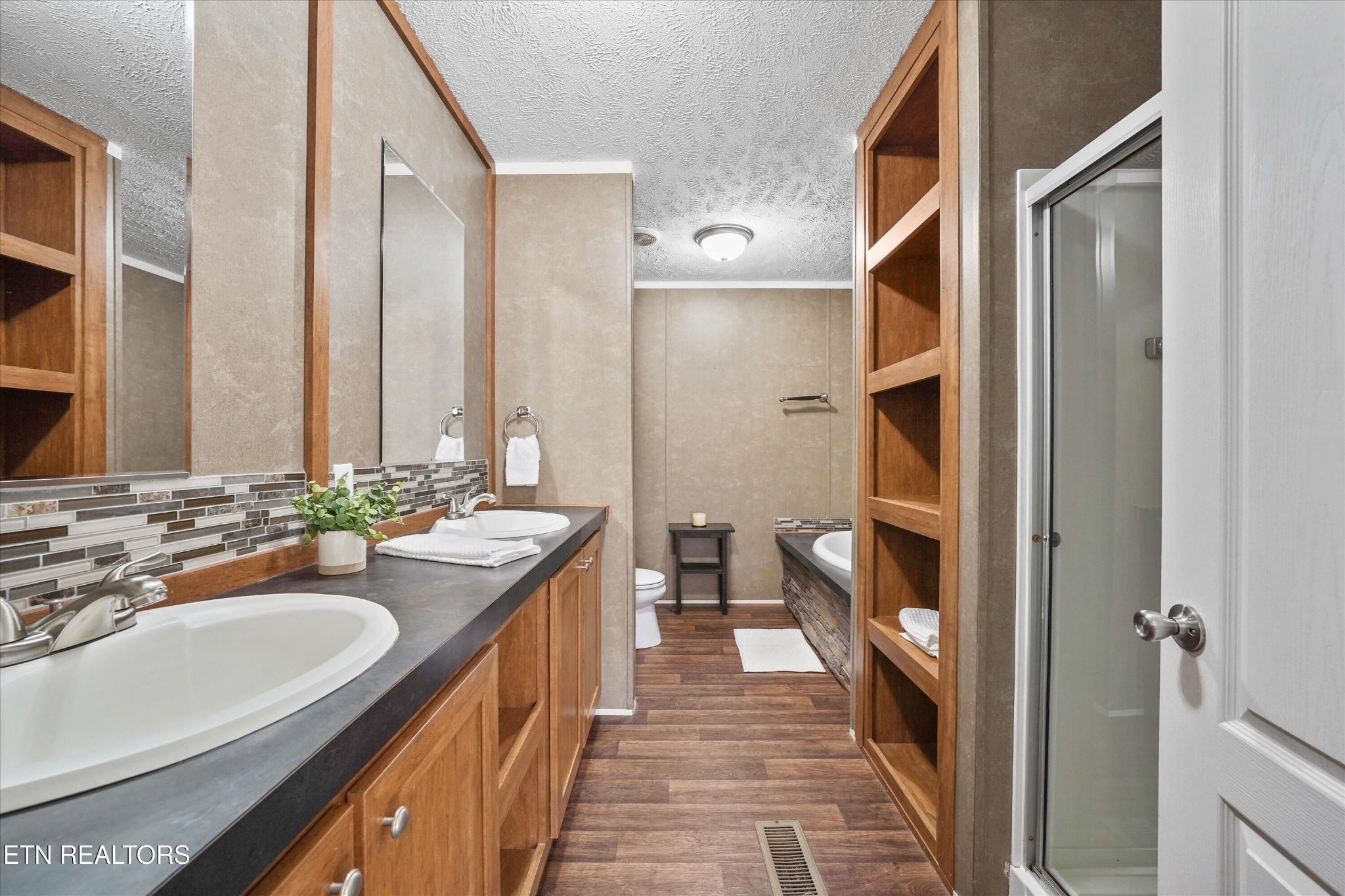 603 Bays Mountain Road Knoxville, TN 37920 - Photo 10 of 30 a bathroom with a sink a toilet and a mirror