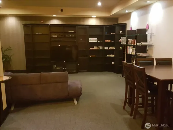 a kitchen with stainless steel appliances a microwave a sink and a refrigerator