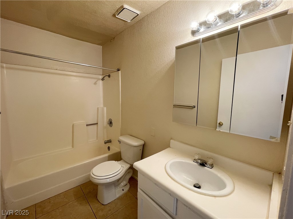 6917 Mendon Lane, Unit 4 Las Vegas, NV 89156 - Photo 12 of 12 Full bathroom featuring light tile patterned floor