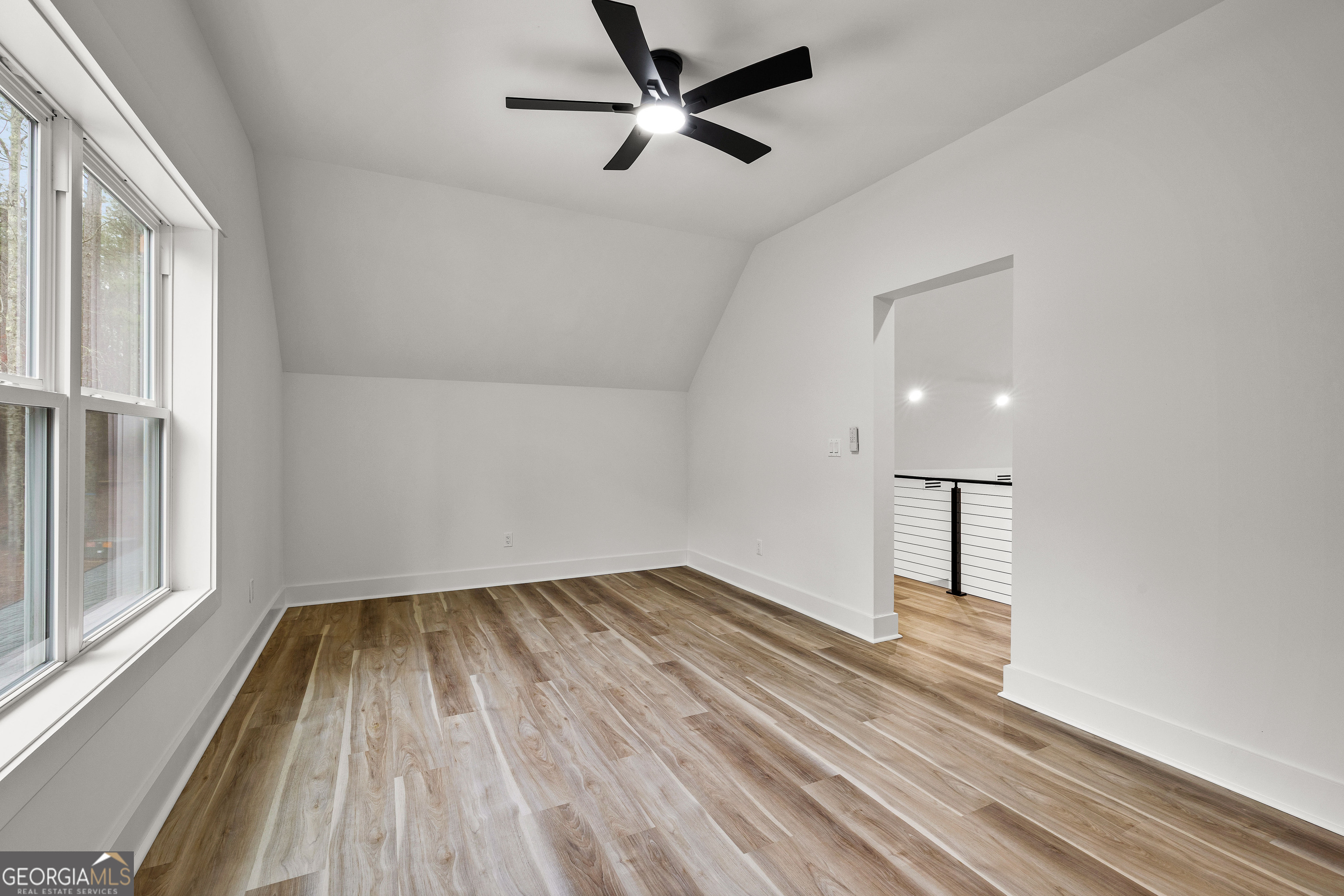 354 Turner Road Newnan, GA 30263 - Photo 50 of 79 a view of empty room with wooden floor and fan
