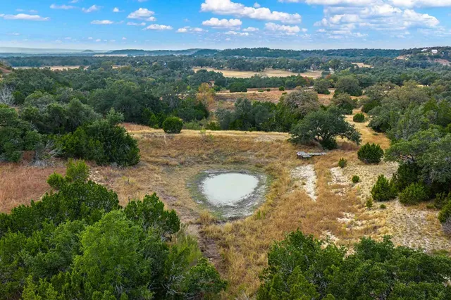 a view of a lake in middle of a city