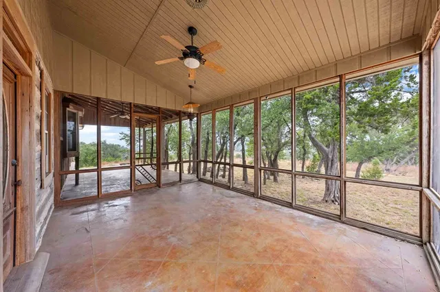 a view of a room with wooden walls and roof