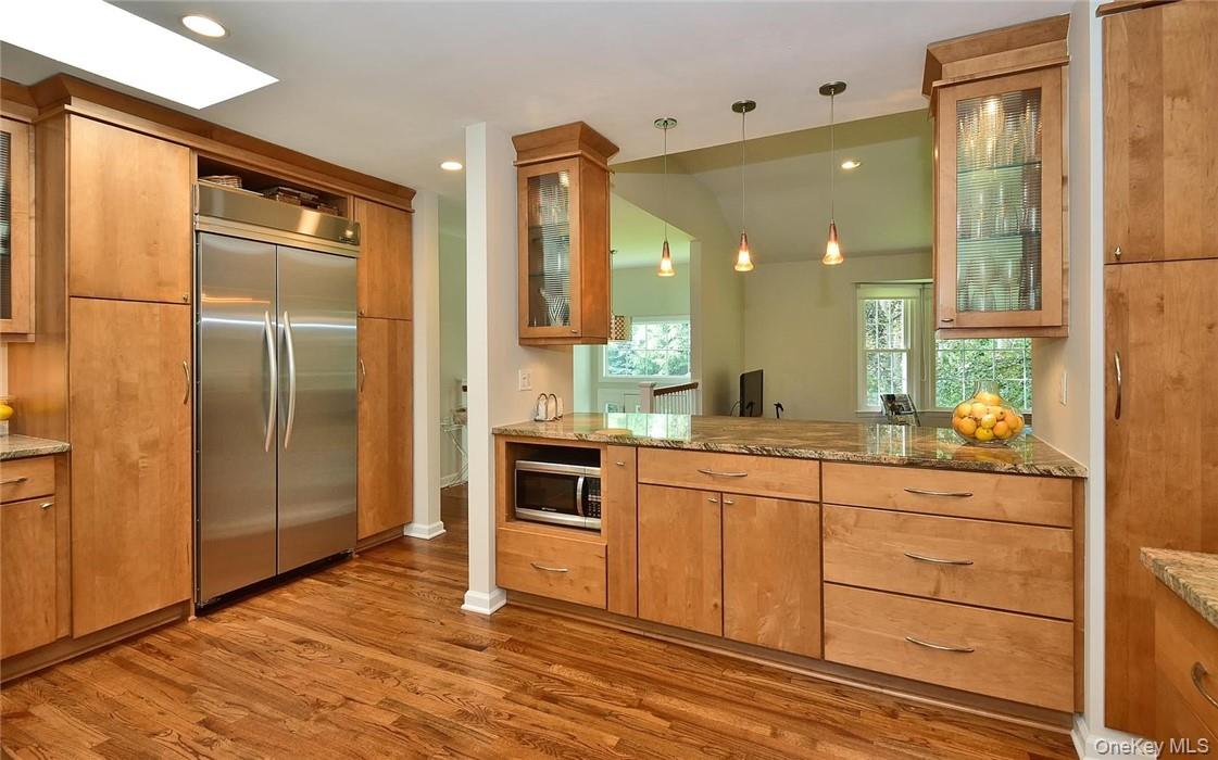 9 Franklin Avenue Rye, NY 10580 - Photo 10 of 35 a kitchen with granite countertop a refrigerator and cabinets
