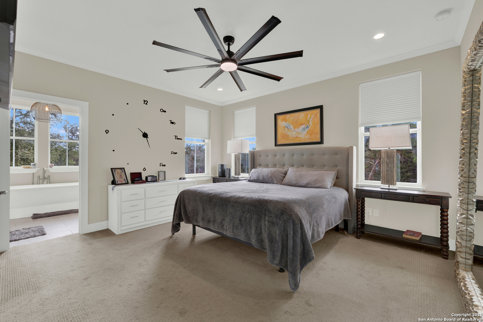 232 Freedom Street Fischer, TX 78623 - Photo 15 of 38 a spacious bedroom with a bed and a window