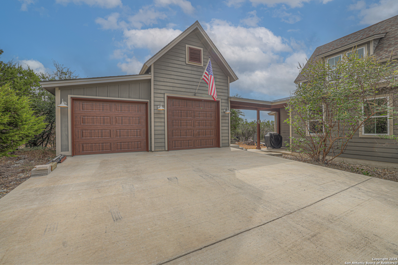 232 Freedom Street Fischer, TX 78623 - Photo 25 of 38 front view of a house with a yard and garage