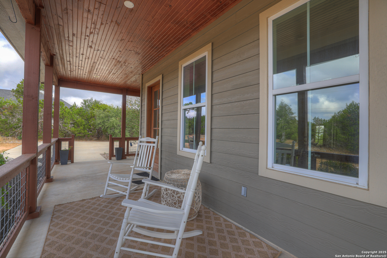 232 Freedom Street Fischer, TX 78623 - Photo 30 of 38 a view of a patio with a table chairs and balcony