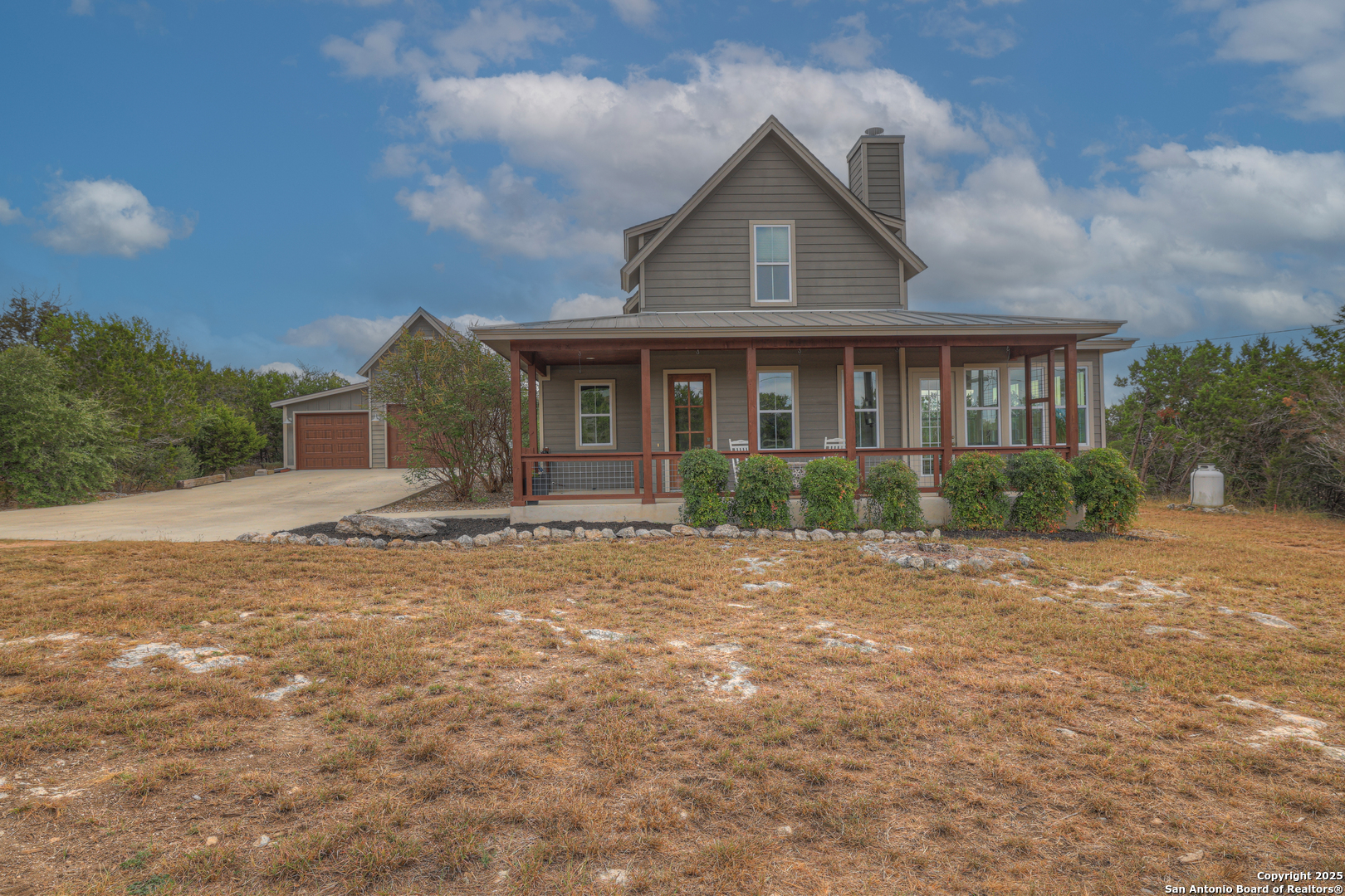 232 Freedom Street Fischer, TX 78623 - Photo 4 of 38 a front view of a house with garden