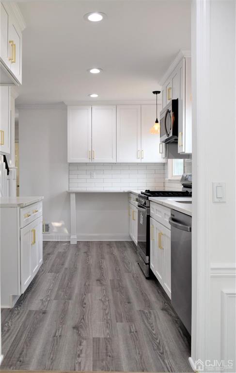 19 Sine Road Edison, NJ 08817 - Photo 5 of 21 a kitchen with white cabinets and appliances
