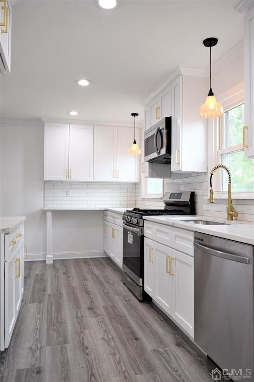 19 Sine Road Edison, NJ 08817 - Photo 6 of 21 a kitchen with a sink cabinets and stainless steel appliances