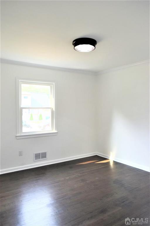 19 Sine Road Edison, NJ 08817 - Photo 10 of 21 an empty room with wooden floor and windows