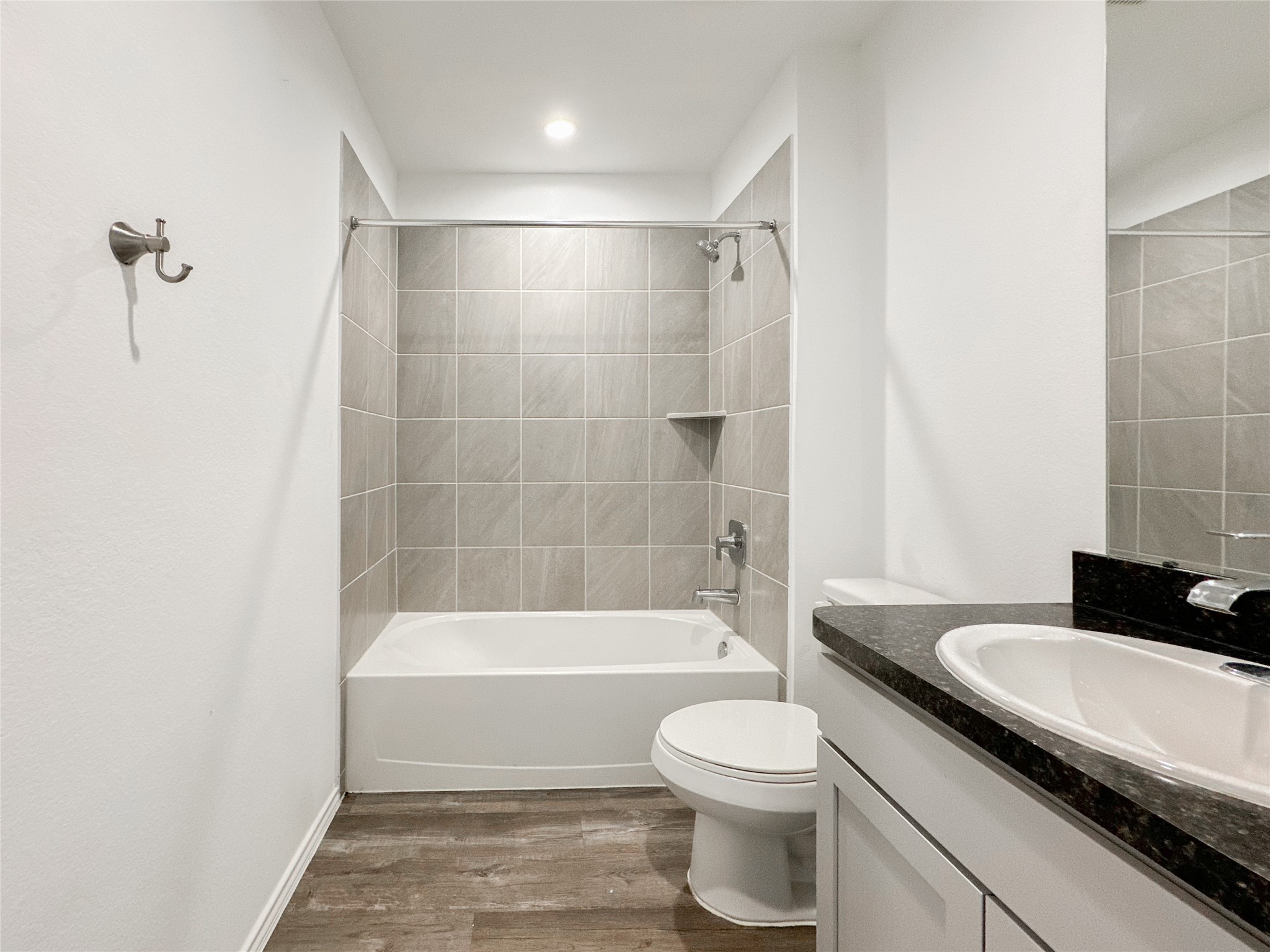 5715 Vintage Oakmont Drive Spring, TX 77373 - Photo 22 of 39 a bathroom with a granite countertop bathtub shower sink vanity and toilet