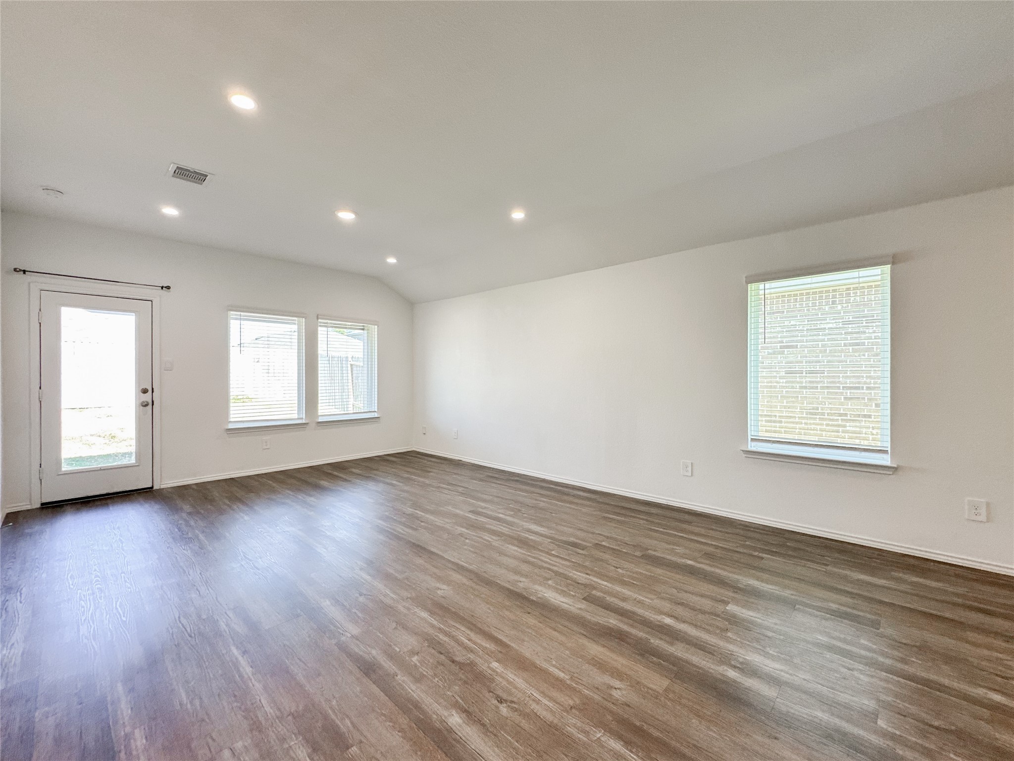 5715 Vintage Oakmont Drive Spring, TX 77373 - Photo 25 of 39 a view of empty room with window and wooden floor