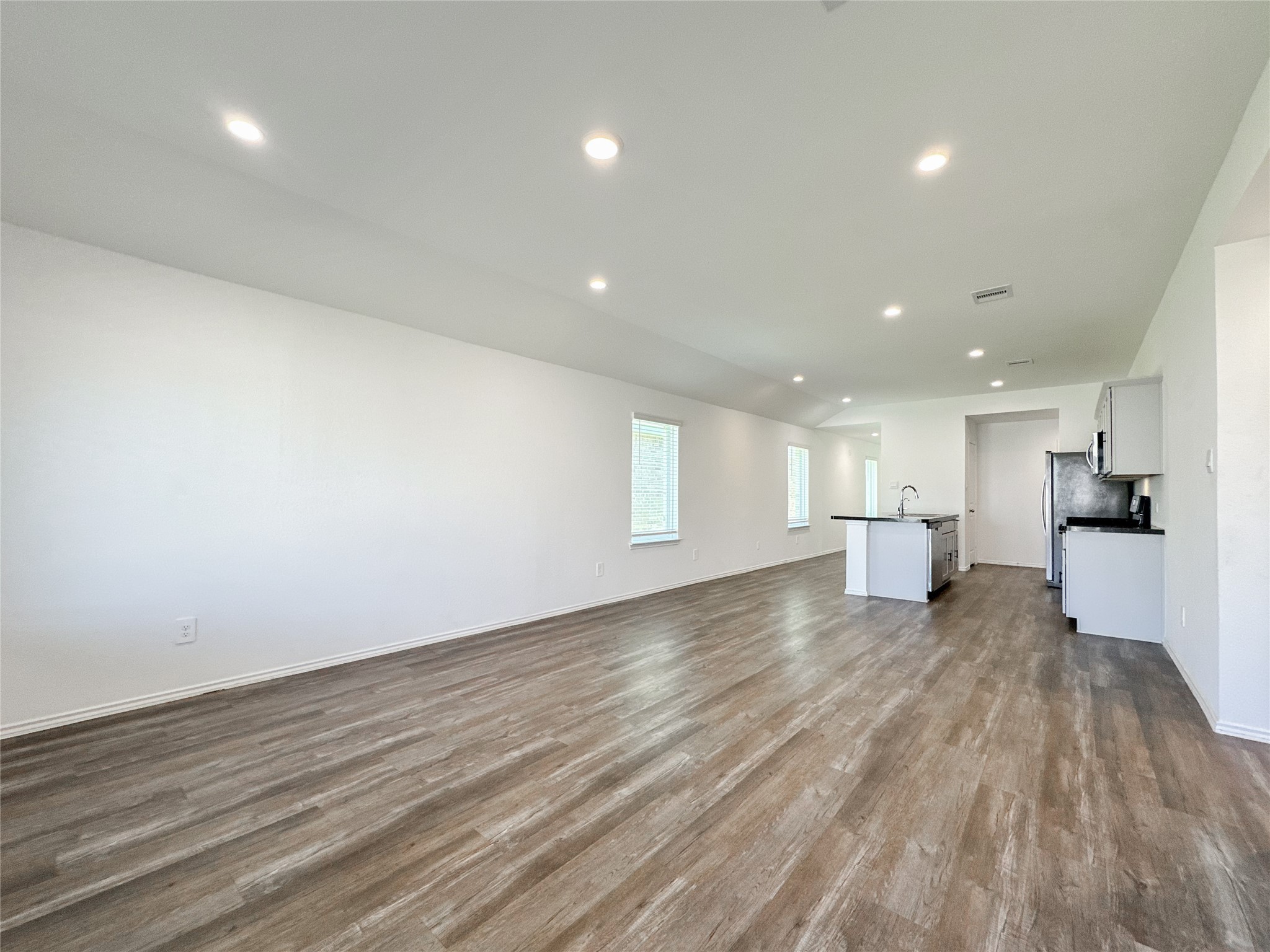 5715 Vintage Oakmont Drive Spring, TX 77373 - Photo 26 of 39 a view of a big room with wooden floor and a window
