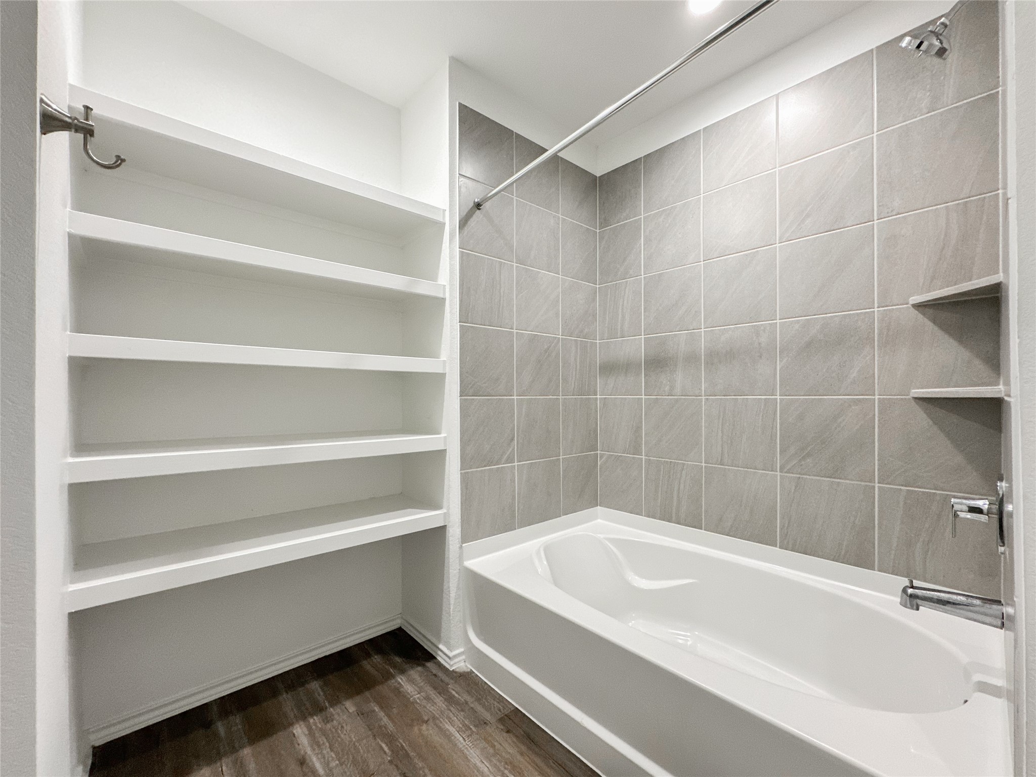 5715 Vintage Oakmont Drive Spring, TX 77373 - Photo 33 of 39 a bathroom with a bathtub and a shower