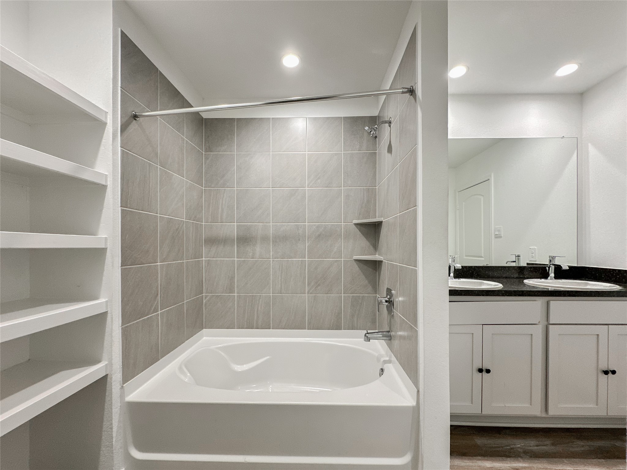 5715 Vintage Oakmont Drive Spring, TX 77373 - Photo 35 of 39 a bathroom with a granite countertop sink a toilet and bathtub