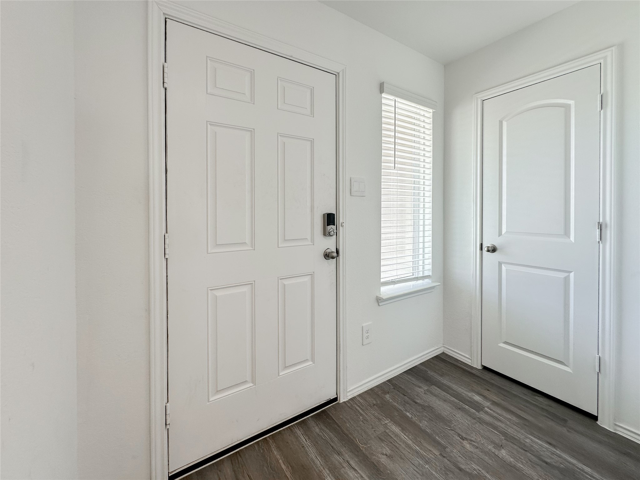 5715 Vintage Oakmont Drive Spring, TX 77373 - Photo 6 of 39 an empty room with wooden floor and windows