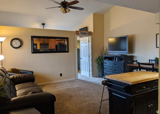 860 Village Road, Unit F7 St. George, UT 84770 - Photo 4 of 18 Carpeted living room with a ceiling fan and lofted ceiling