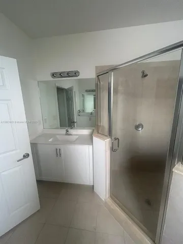 a view of an empty room and wooden floor