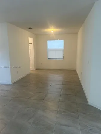 a view of an empty room and window
