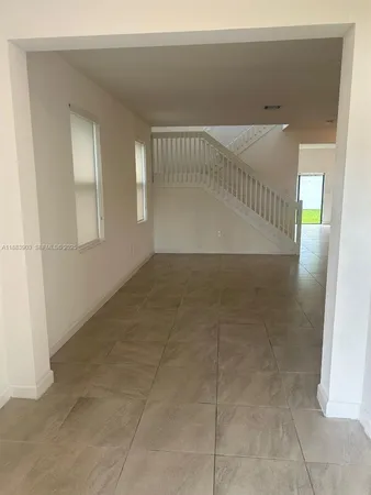 a view of an empty room with windows