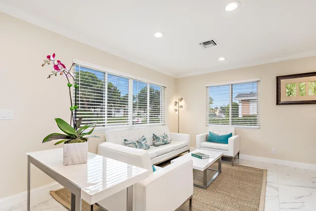 a living room with furniture and window