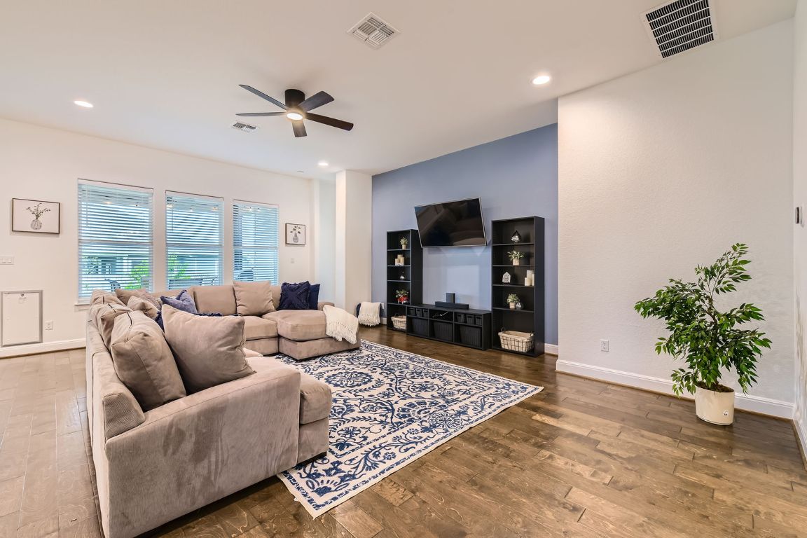 1332 Modoc Way Kyle, TX 78640 - Photo 7 of 28 Living room featuring a ceiling fan, wood finished floors, and recessed lighting