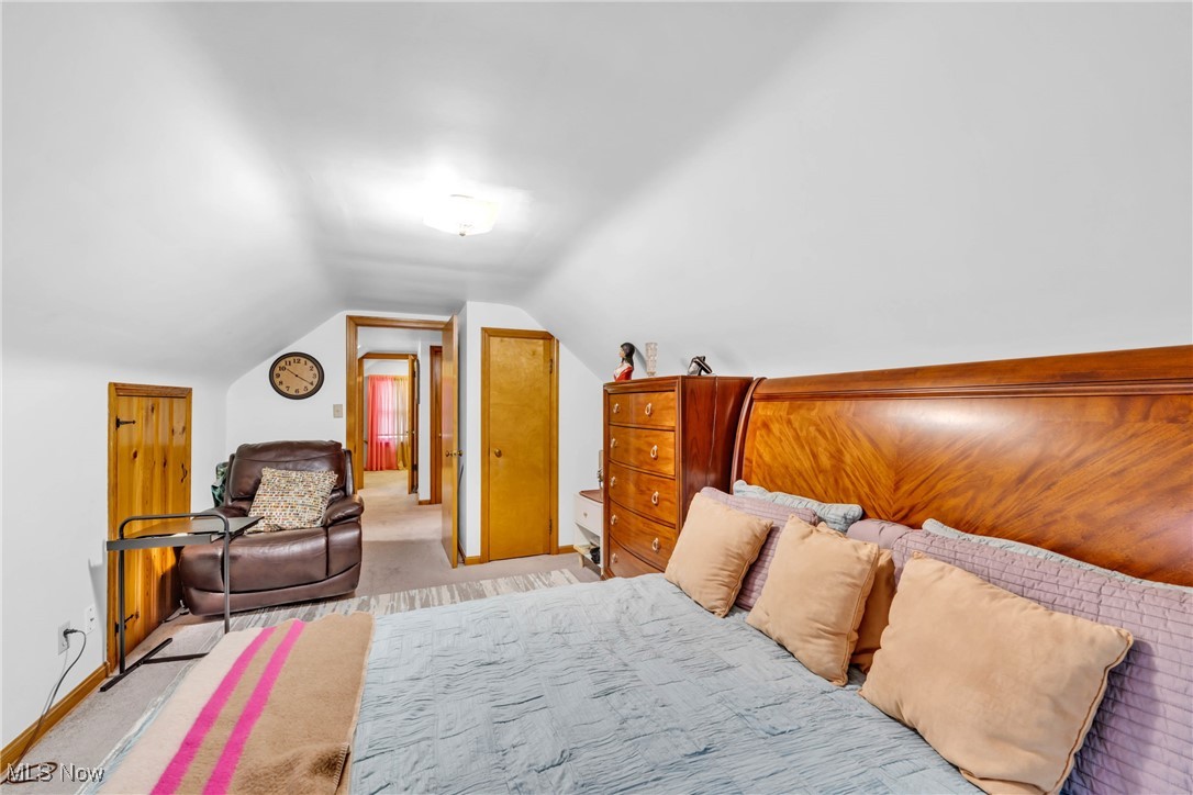 631 Trebisky Road Cleveland, OH 44143 - Photo 23 of 33 Bedroom featuring vaulted ceiling and light colored carpet