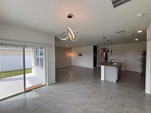 a view of an empty room and a window