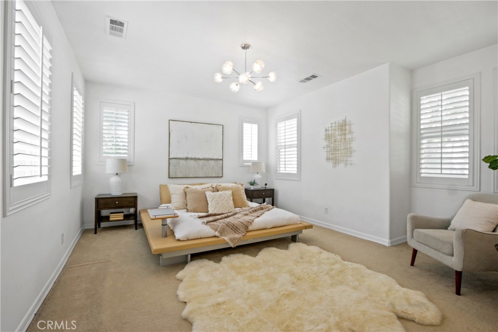 9 Paddock Place Ladera Ranch, CA 92694 - Photo 15 of 25 a living room with furniture and a chandelier