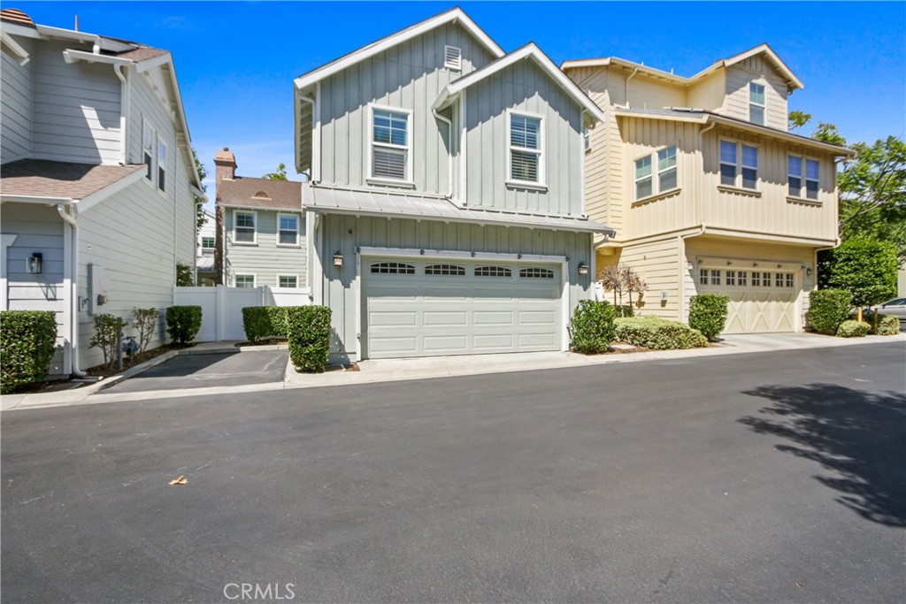 9 Paddock Place Ladera Ranch, CA 92694 - Photo 24 of 25 a front view of a house with a yard and garage