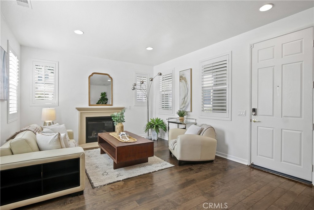 9 Paddock Place Ladera Ranch, CA 92694 - Photo 3 of 25 a living room with furniture and a fireplace