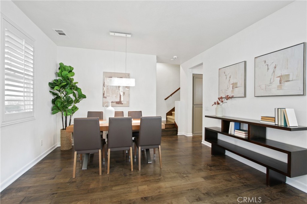 9 Paddock Place Ladera Ranch, CA 92694 - Photo 5 of 25 a view of a dining room with furniture and wooden floor