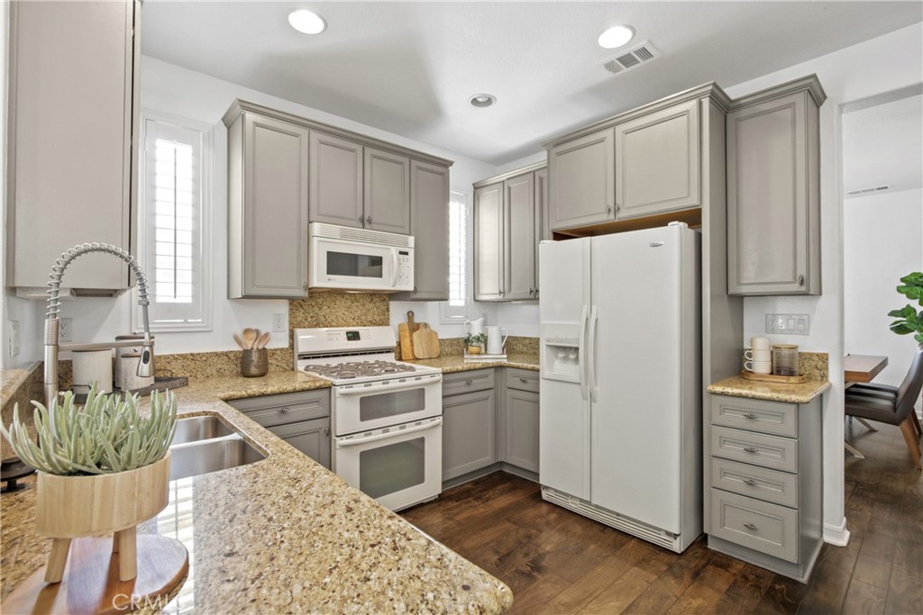 9 Paddock Place Ladera Ranch, CA 92694 - Photo 9 of 25 a kitchen with a refrigerator stove and sink