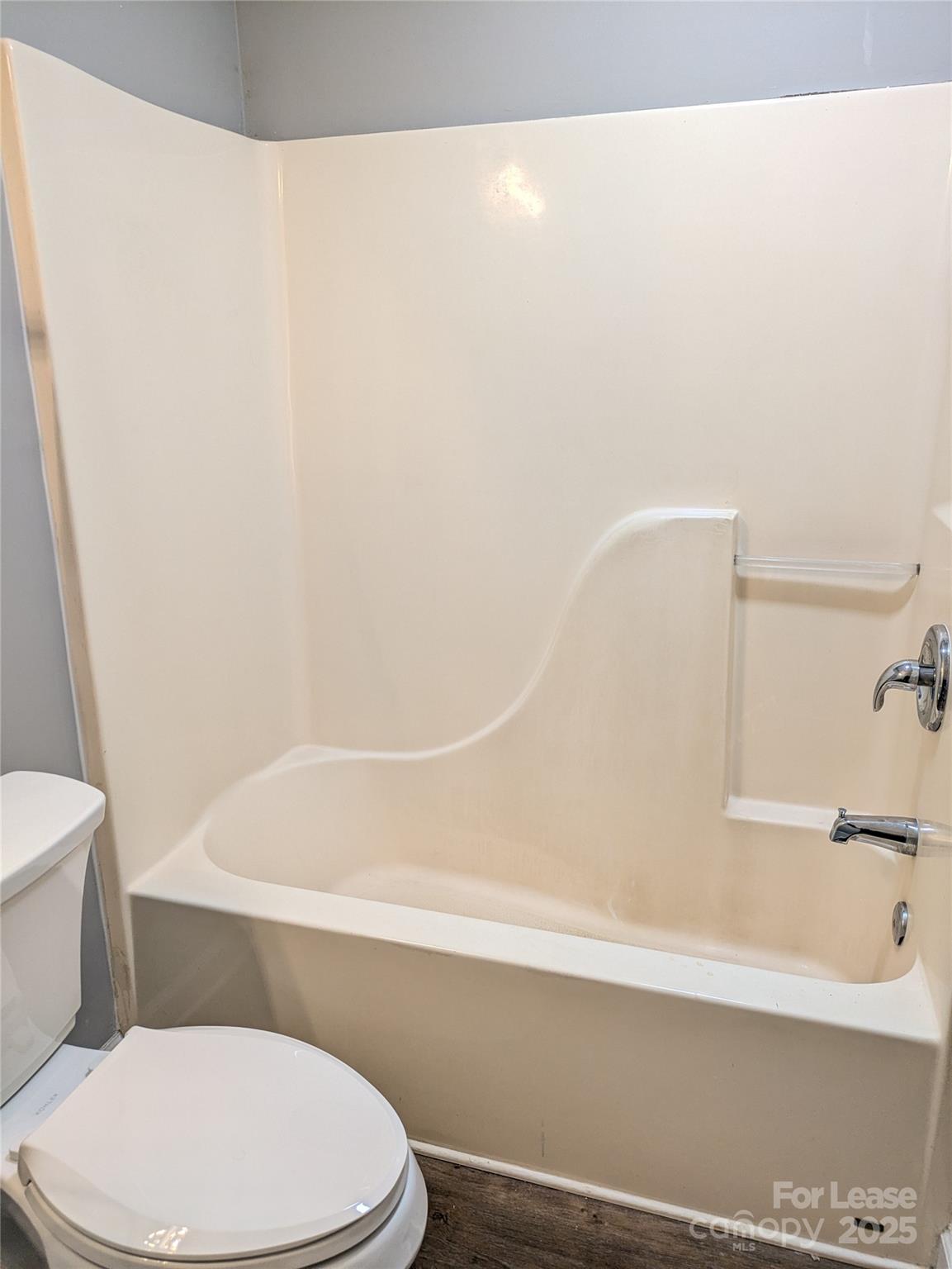 149 McKendree Road Mooresville, NC 28117 - Photo 20 of 21 a bathroom with a toilet and a bathtub