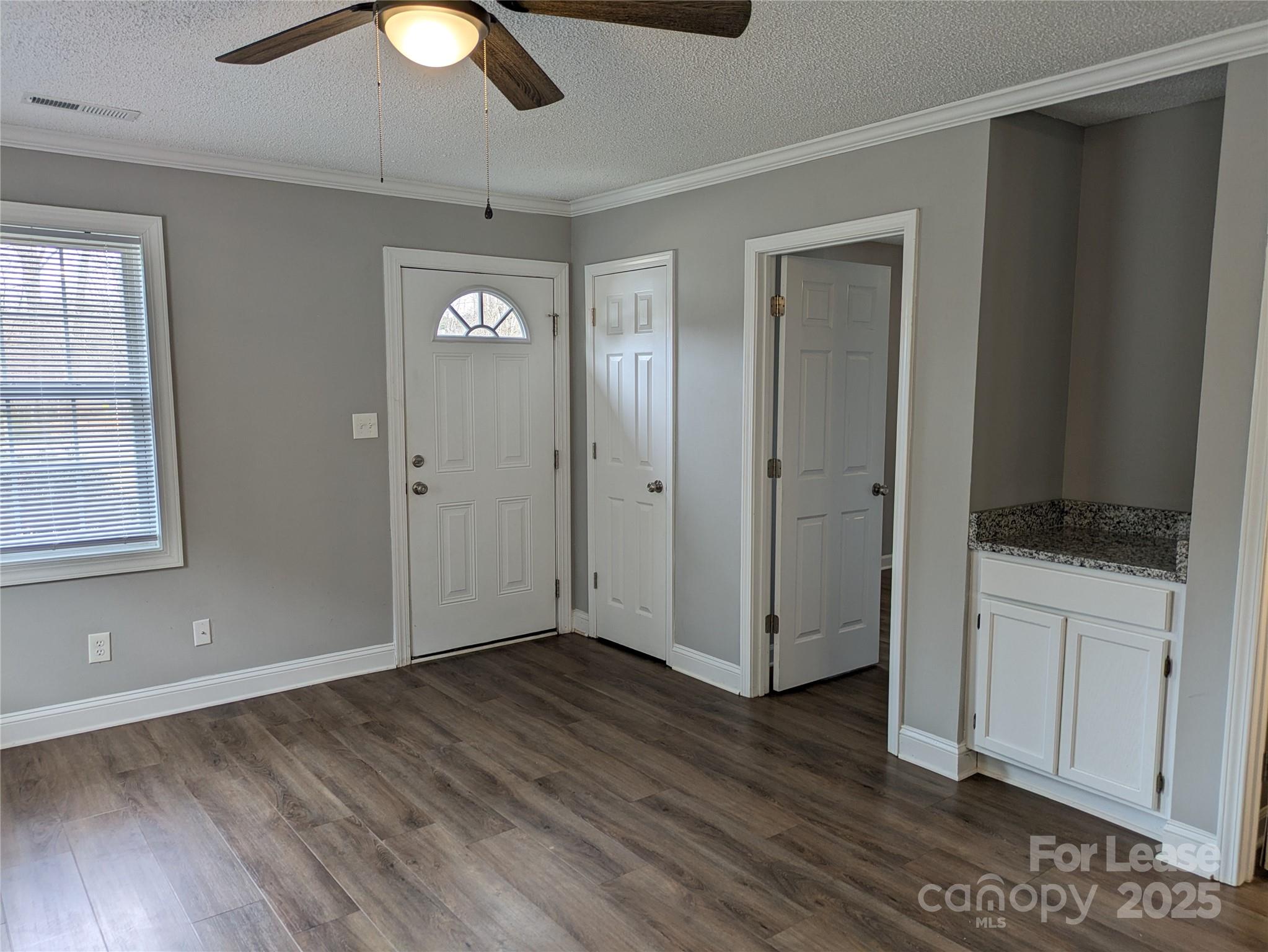 149 McKendree Road Mooresville, NC 28117 - Photo 4 of 21 wooden floor in an empty room with a window