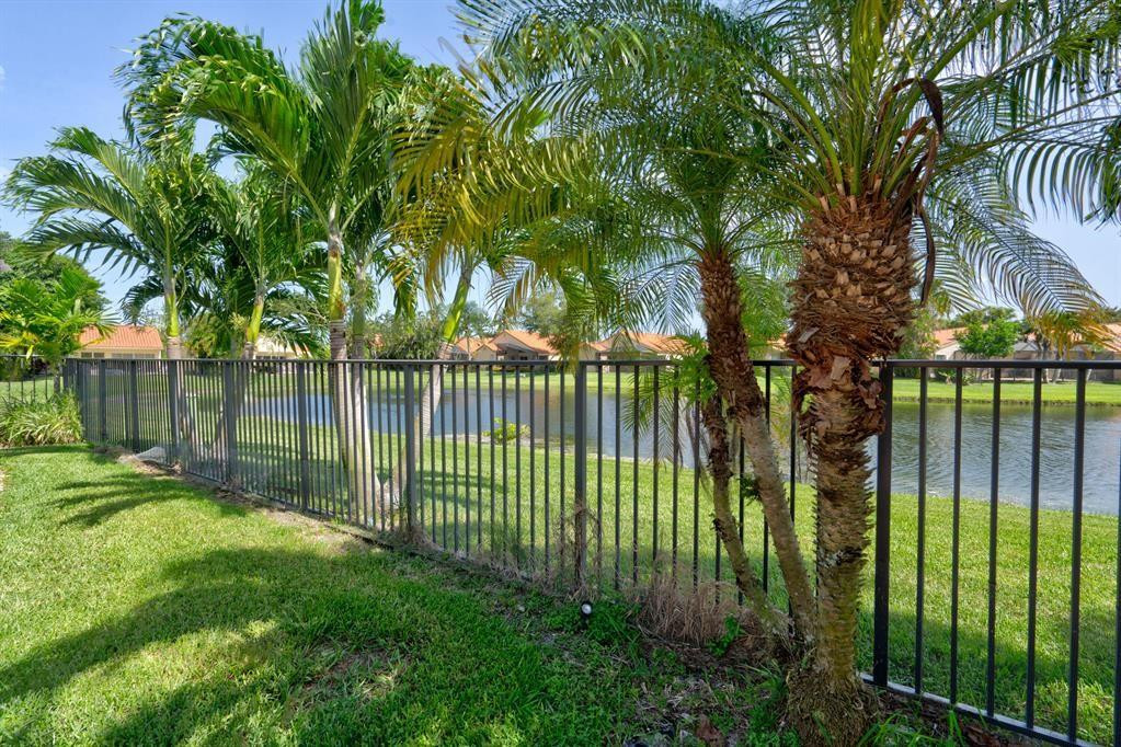 8410 Brussels Way Boca Raton, FL 33434 - Photo 38 of 69 VIEW FROM THE BACK YARD FENCE TO LAKE