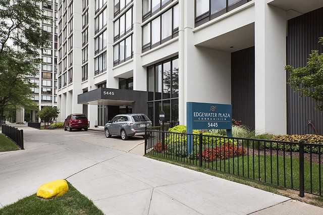 5445 North Sheridan Road, Unit 2005 Chicago, IL 60640 - Photo 2 of 19 a view of a building with car parked