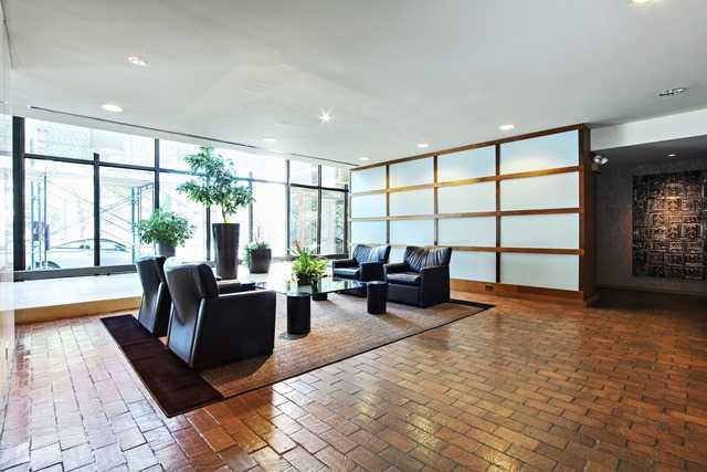5445 North Sheridan Road, Unit 2005 Chicago, IL 60640 - Photo 7 of 19 a living room with furniture and large windows
