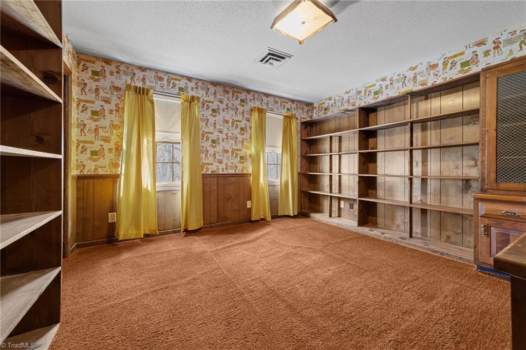 4532 Peeples Road Oak Ridge, NC 27310 - Photo 15 of 49 Bonus room Or Office on the 2nd floor with built in shelves.