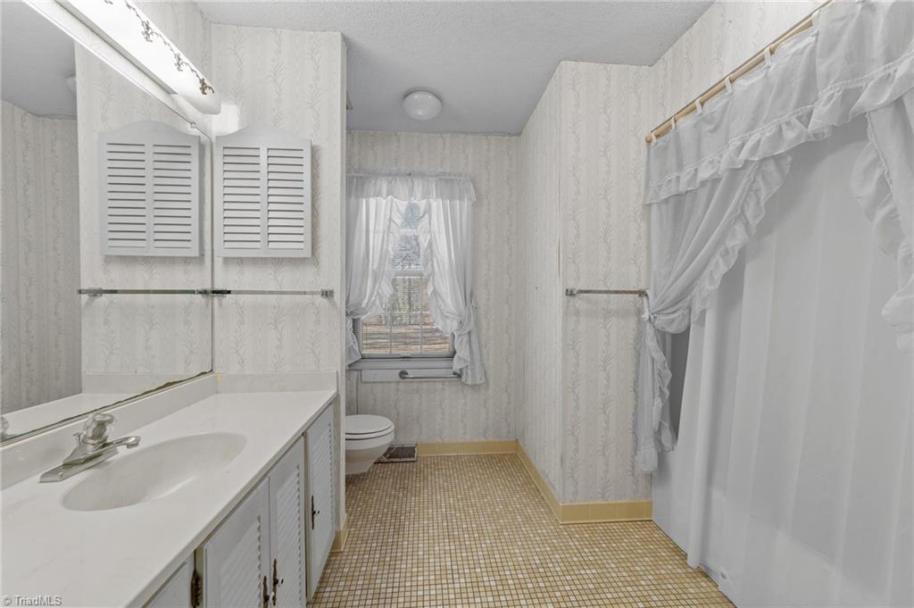 4532 Peeples Road Oak Ridge, NC 27310 - Photo 23 of 49 Hall bath with shower and tub combo.