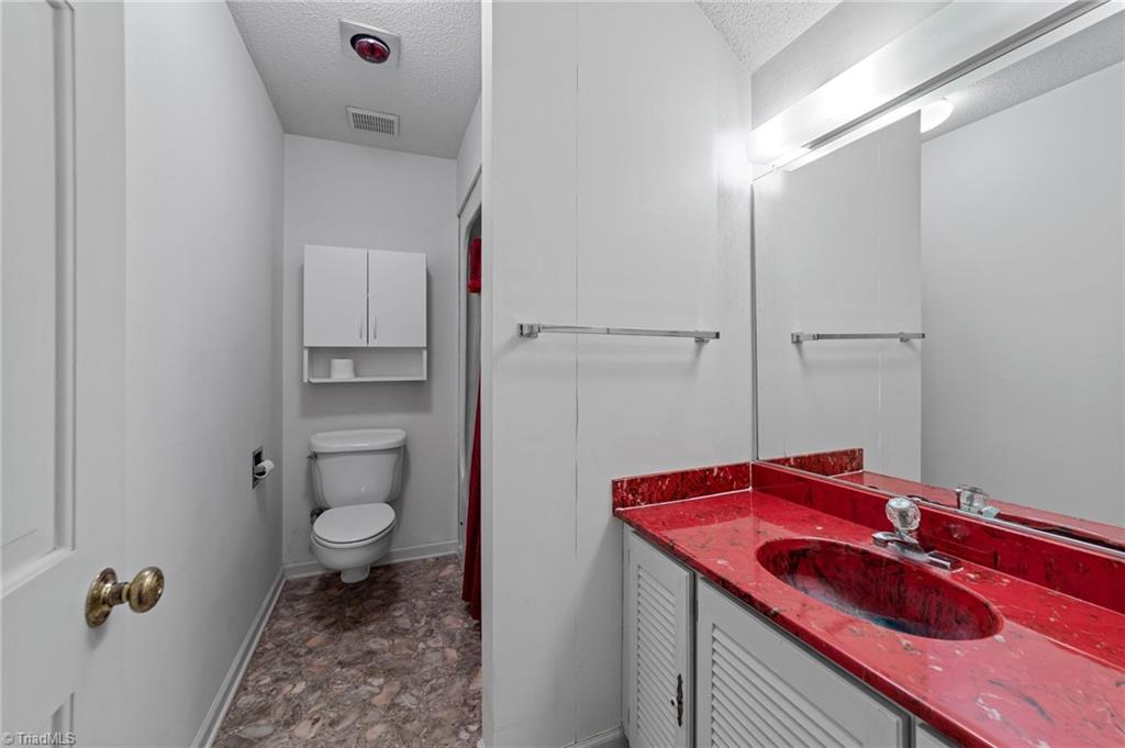 4532 Peeples Road Oak Ridge, NC 27310 - Photo 29 of 49 Full bathroom on 2nd floor with shower/tub combo.