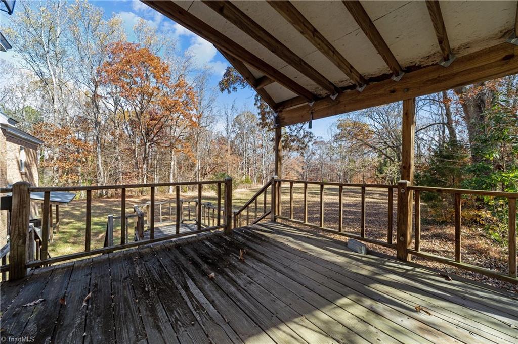 4532 Peeples Road Oak Ridge, NC 27310 - Photo 35 of 49 Back deck overlooking quiet backyard.