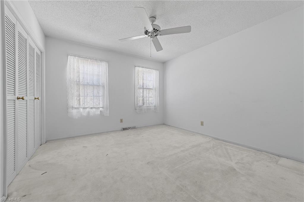 4532 Peeples Road Oak Ridge, NC 27310 - Photo 8 of 49 2nd bedroom on the main floor with ample closet storage.