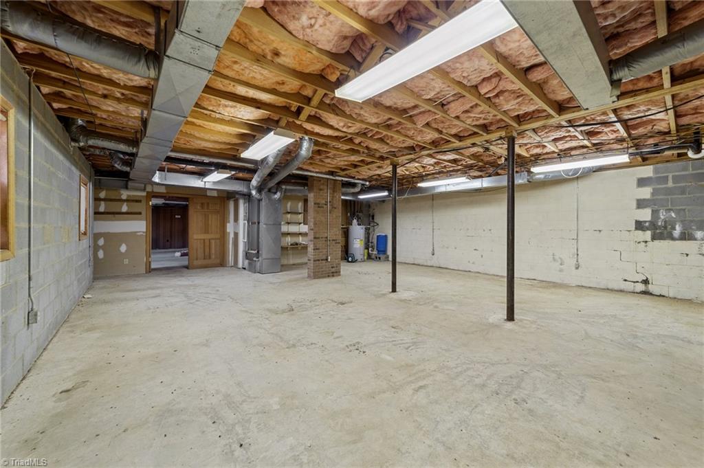 4532 Peeples Road Oak Ridge, NC 27310 - Photo 10 of 49 Workshop area in basement with tons of space.