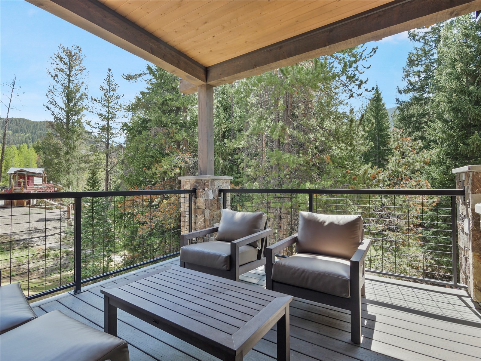 75 Alcove Court, Unit 75 Keystone, CO 80435 - Photo 25 of 40 a view of a deck with two chair and wooden floor