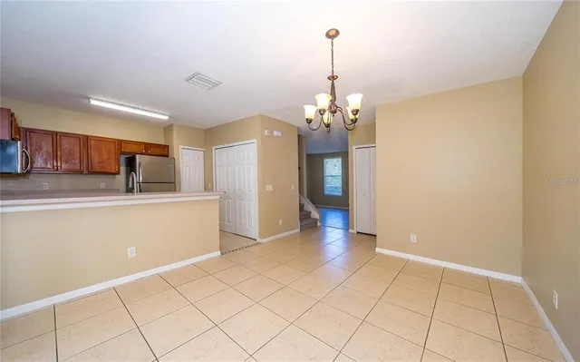 a view of a kitchen with microwave and cabinets