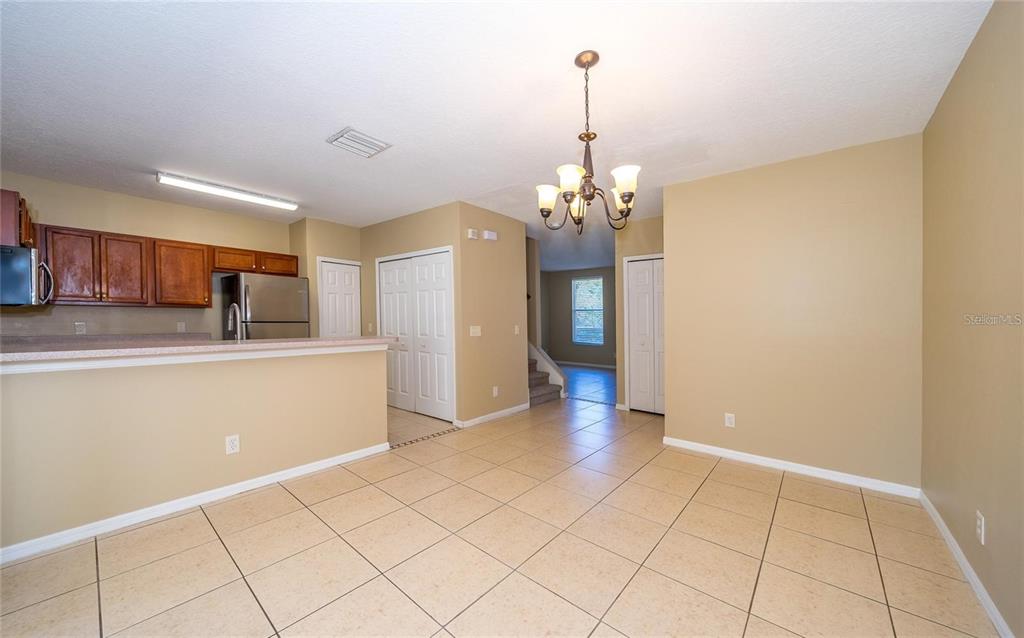 1238 Beckenham Way Wesley Chapel, FL 33543 - Photo 13 of 31 a view of a kitchen with microwave and cabinets