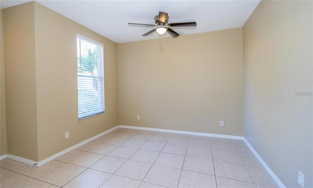1238 Beckenham Way Wesley Chapel, FL 33543 - Photo 5 of 31 a view of an empty room with a window